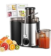 en acier inoxydable avec base noire, récipient de collecte et livre de recettes, présenté avec des agrumes et des carottes