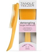 Le texte indique « Grande brosse à cheveux démêlante TANGLE TEEZER » et « CURLY - COILY ». Brosse démêlante jaune à longs poils souples dans un emballage de vente au détail.
