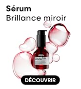Le texte indique « Sérum » et « Brilliance miroir » avec « DÉCOUVRIR ». L'image du produit montre un flacon cosmétique noir avec compte-gouttes sur fond blanc avec des éléments décoratifs roses.