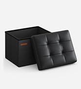 un pouf en cuir noir avec assise en cuir marron.