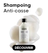 Le texte se lit comme suit : « Shampoing Anti-case » et « DÉCOUVRIR ». La photo du produit montre une bouteille blanche de shampoing anti-casse sur fond blanc mousseux.