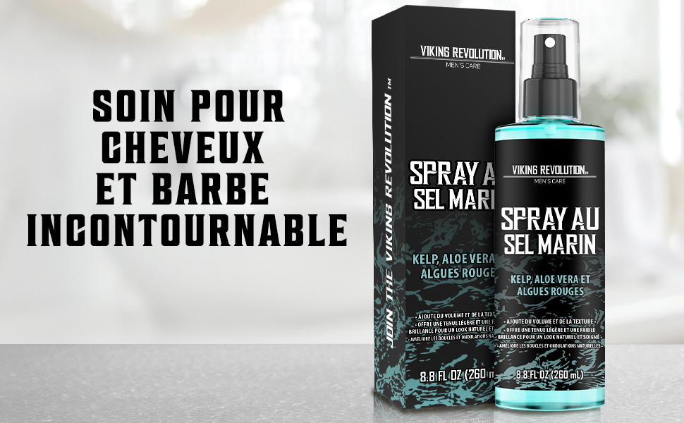 . Flacon pulvérisateur bleu avec emballage noir. Le texte indique qu'il s'agit d'un spray au sel marin pour la coiffure.