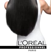 Texte : « L'ORÉAL PROFESSIONNEL PARIS ». Série d'échantillons de cheveux noirs disposés de manière à montrer les étapes progressives du coiffage ou du traitement.