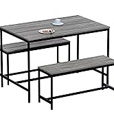 avec table grise et bancs assortis avec des cadres en métal noir au design de style industriel.