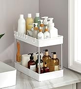 Étagère de rangement de salle de bain blanche à deux niveaux contenant divers flacons et distributeurs de produits de toilette, positionnée sur un comptoir blanc contre