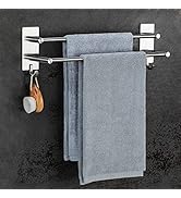 Porte-serviettes mural en acier inoxydable avec deux barres horizontales. Dispose de deux crochets en dessous. Peut contenir des serviettes bleu-gris. Adhère au mur à l'aide de pastilles adhésives