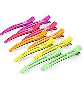 Collection de clips ou de pinces en plastique colorés disposés en rangées, présentant des variations de couleurs rose vif, orange, jaune et vert.