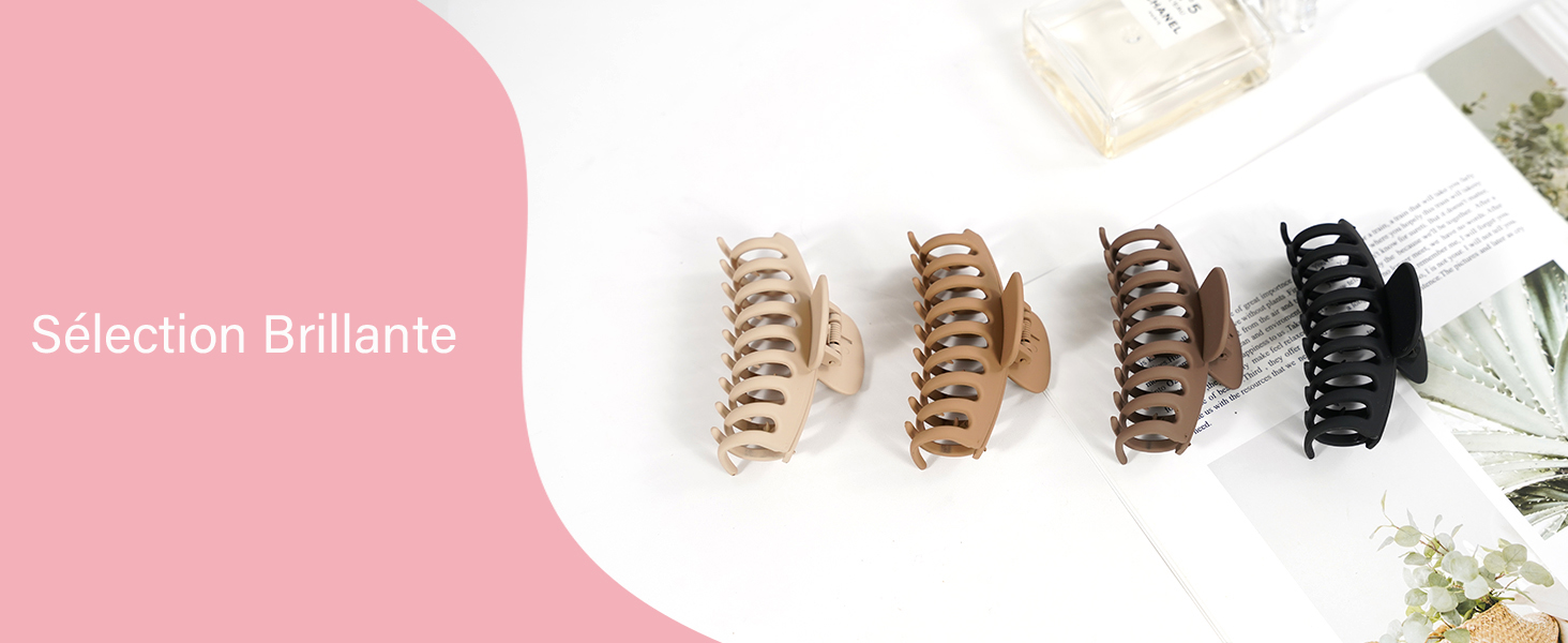 Quatre pinces à cheveux disposées en rangée, présentant un dégradé de couleurs allant du beige clair au noir, avec un motif de griffe incurvée à plusieurs dents.