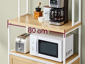 Le texte indique « 30 cm ». L'image montre une étagère ou un support à micro-ondes blanc avec un marquage dimensionnel indiquant la mesure de la largeur.