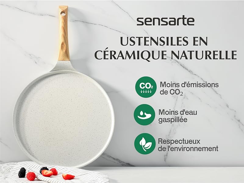 Sensarte. Poêle à frire blanche sur une surface en marbre. Caractéristiques écologiques : moins d'émissions de CO2, économie d'eau, respect de l'environnement