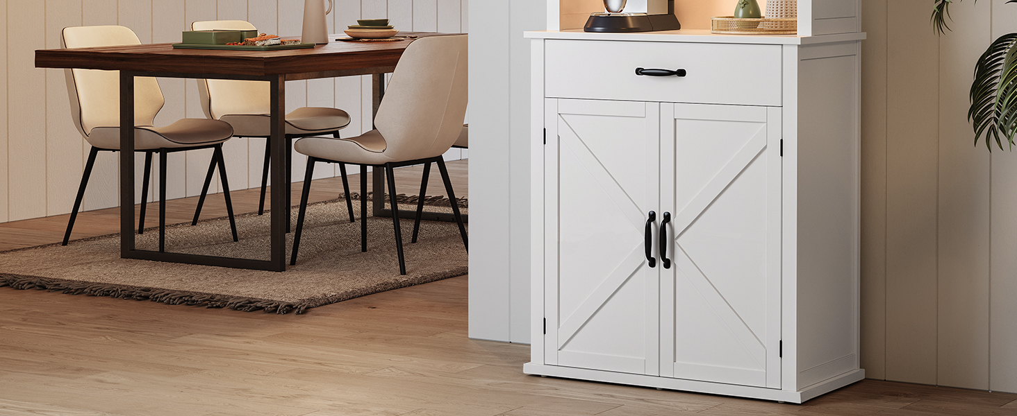 une armoire blanche avec une poignée noire à côté d'une table.