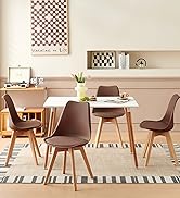 une table de salle à manger avec une table et des chaises blanches.
